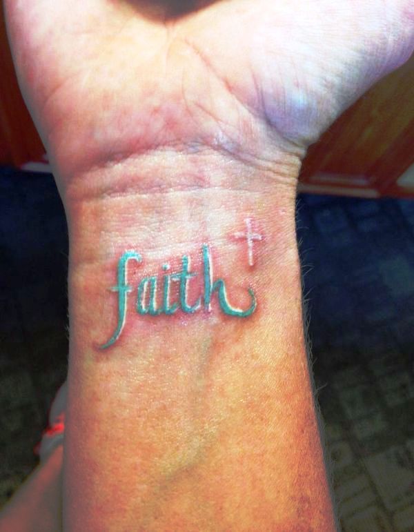 Green Ink Faith Tattoo On Wrist