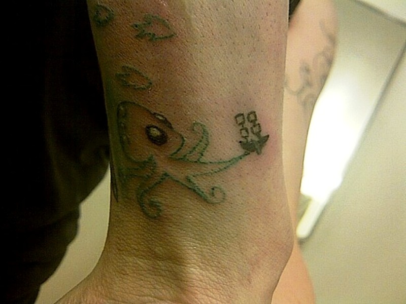 Green Octopus Tattoo On Wrist