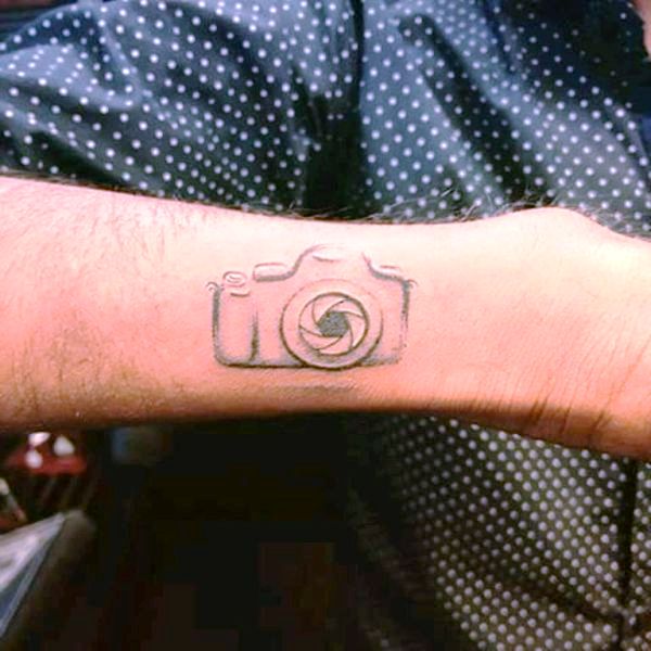 Grey Camera Tattoo On Wrist