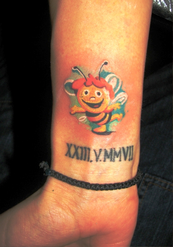 Happy Bee Tattoo On Wrist