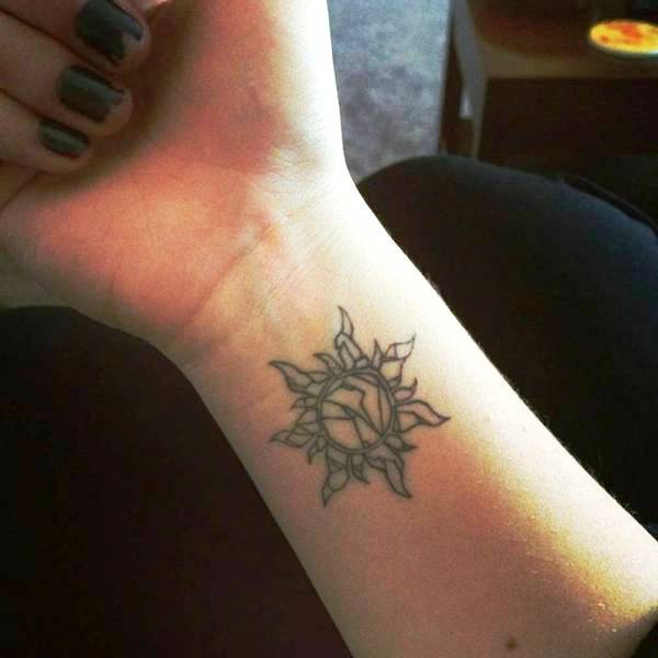 Impressive Sun Tattoo On Wrist