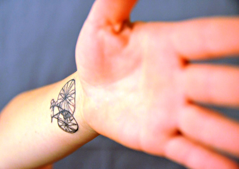 Impressive Wrist Cycle Tattoo