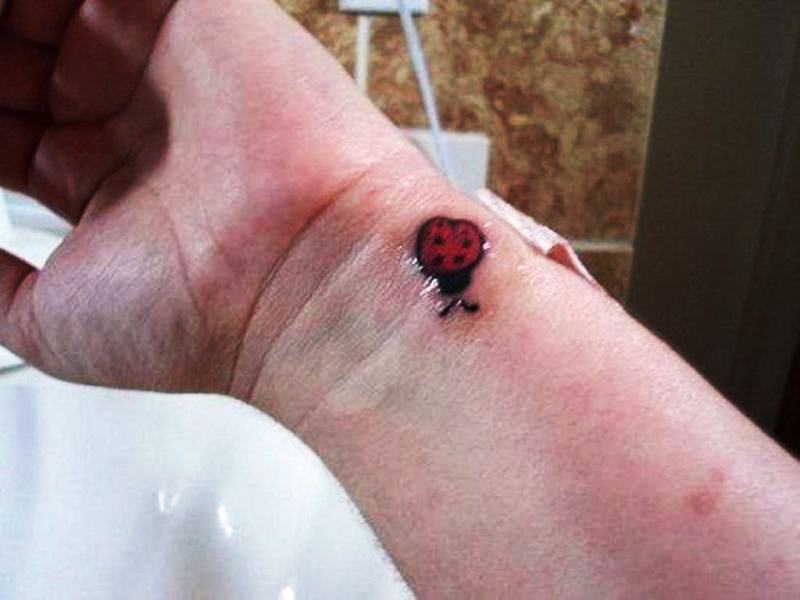 Ladybug Tattoo On Left Wrist