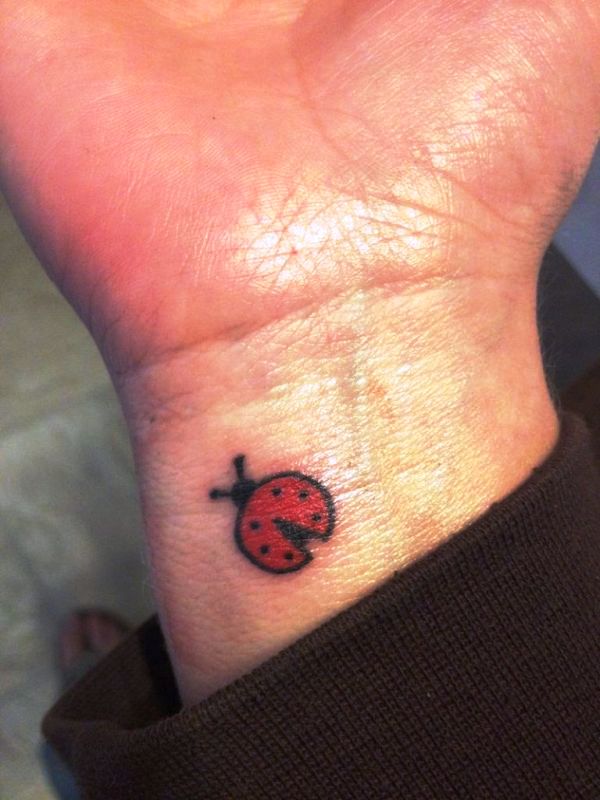 Ladybug Tattoo On Right Wrist