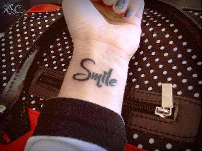 Large Smile Tattoo On Wrist