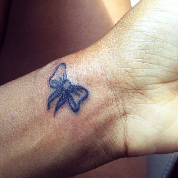 Little Blue Bow Tattoo On Wrist