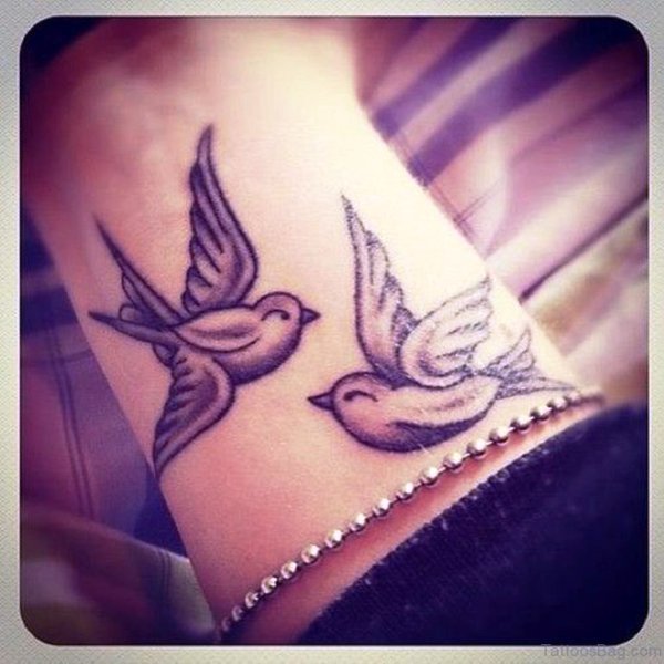 Lovely Flying Dove Tattoo On Wrist