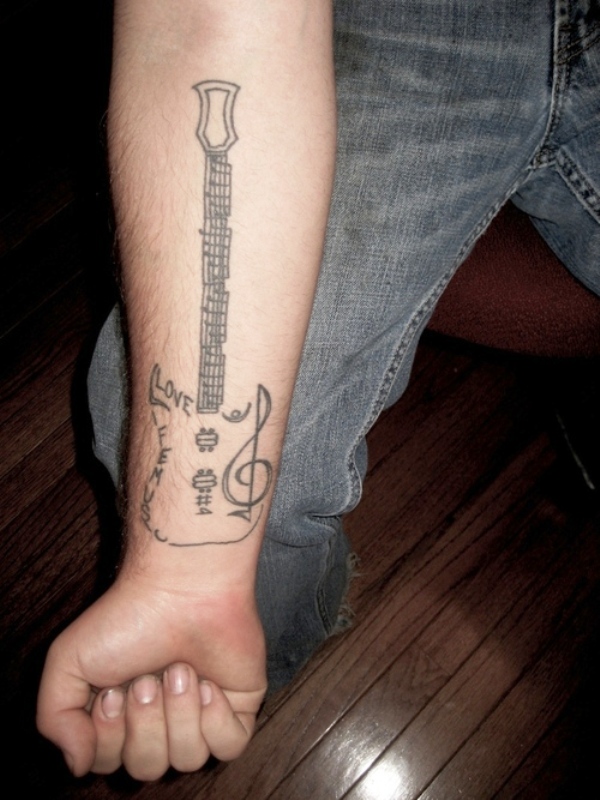 Lovely Guitar Tattoo On Wrist