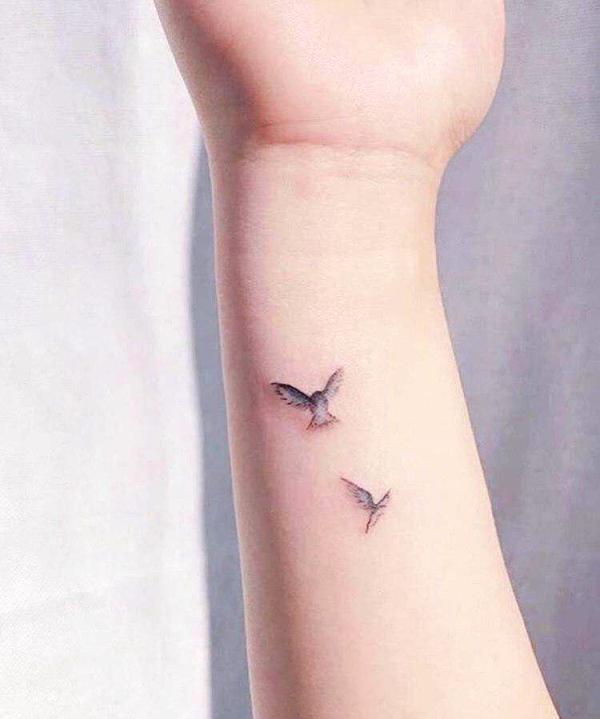 Lovely Small Flying Birds Tattoo