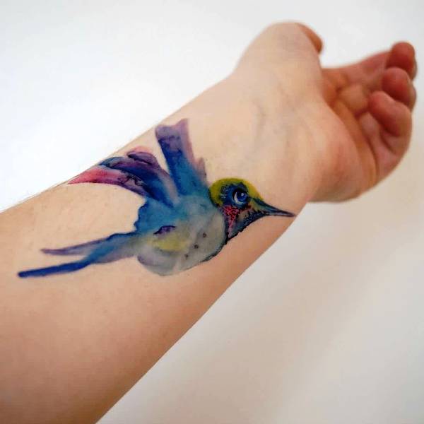 Lovely Watercolor Blue Bird Tattoo On Wrist