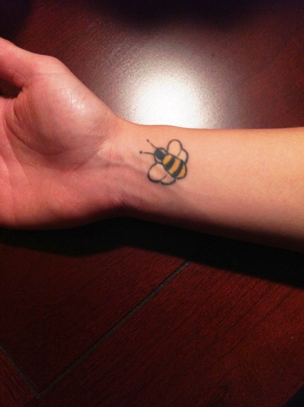 Lovely Yellow Bee Tattoo On Wrist