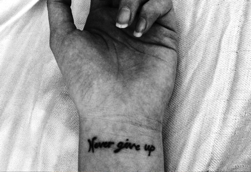 Never Give Up Wrist Tattoo