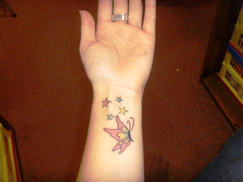 Nice Butterfly And Star Tattoo On Wrist