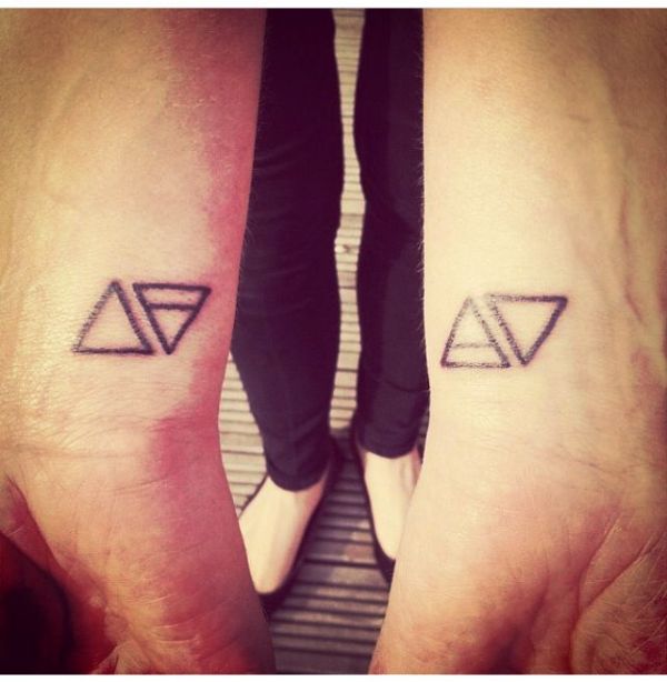 Nice Two Triangle Tattoo On Wrist