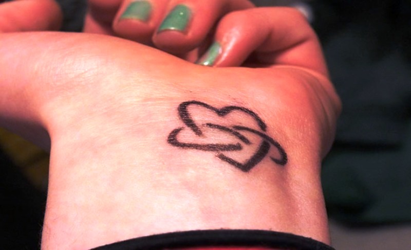 Outer Heart Tattoo On Wrist