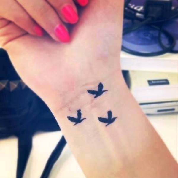 Pic Of Flying Birds Tattoo Design