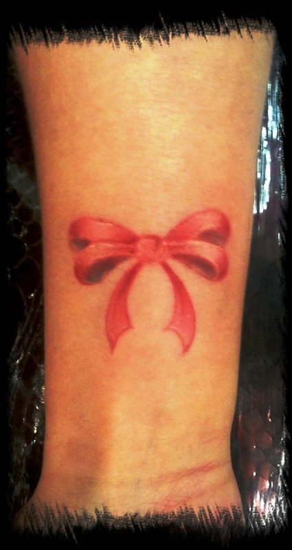 Pic Of Red Bow Tattoo On Wrist