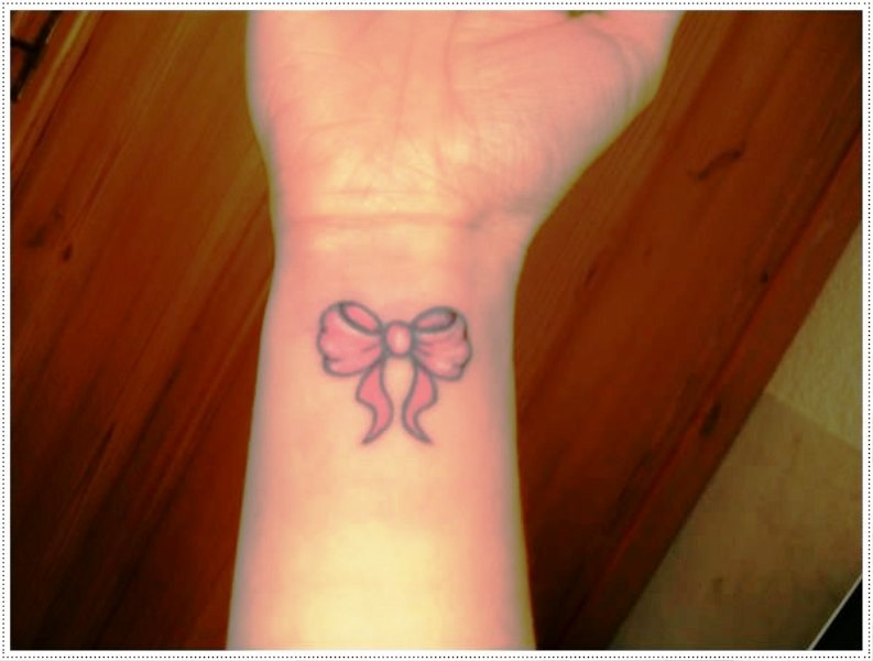 Pink Bow Tattoo On Wrist