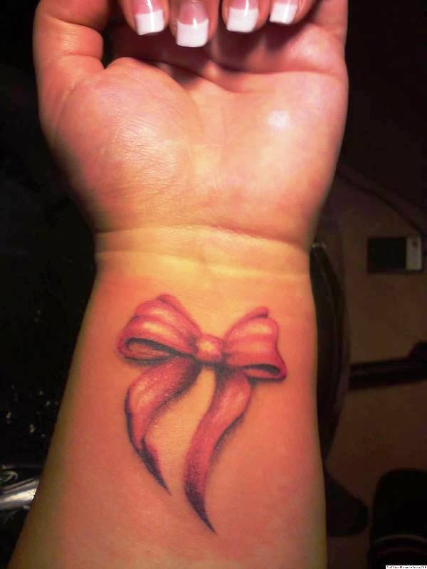 Pink Ribbon Bow Tattoo On Wrist