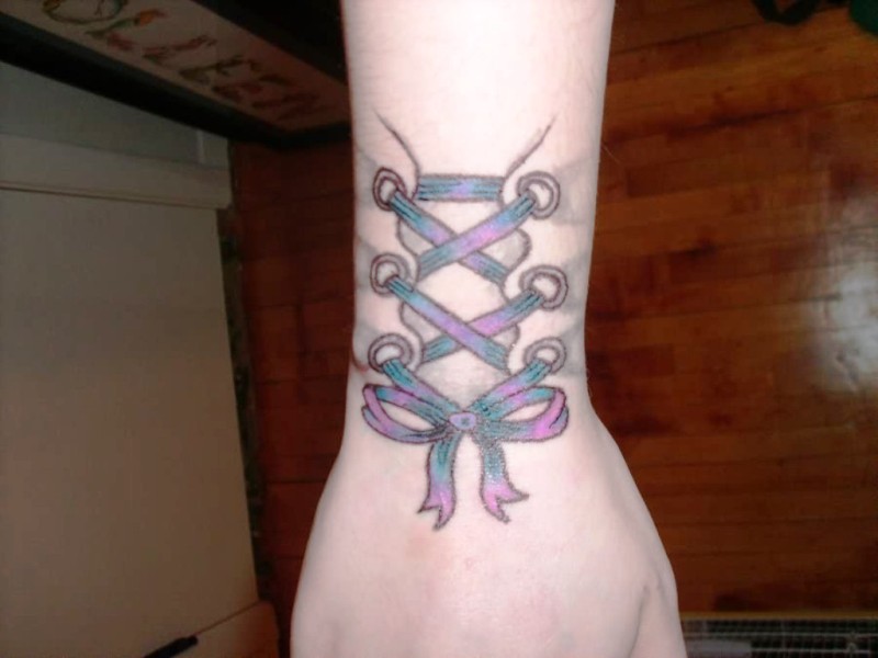 Purple Corset Wrist Tattoo