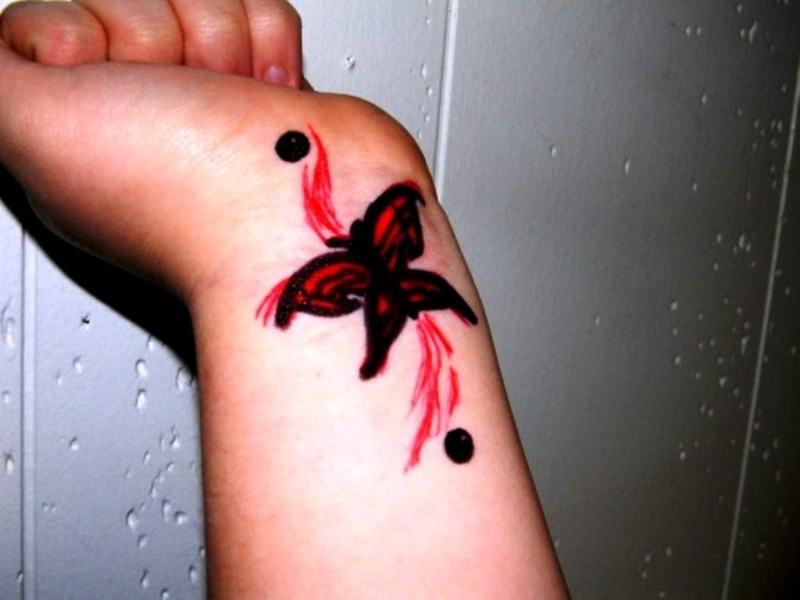 Red Butterfly Tattoo On Wrist