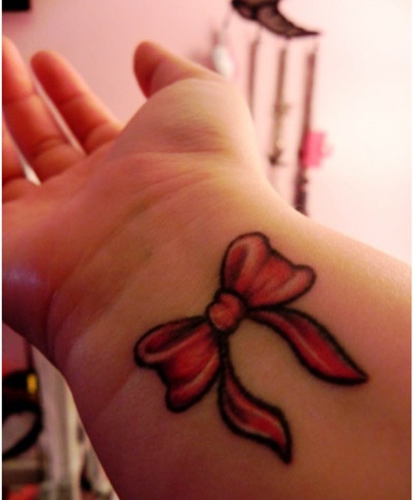Red Ribbon Tattoo On Wrist