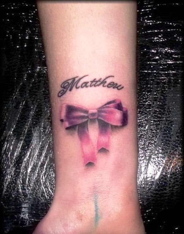 Ribbon And Name Wrist Tattoo