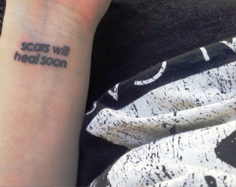 Scars Wrist Tattoo