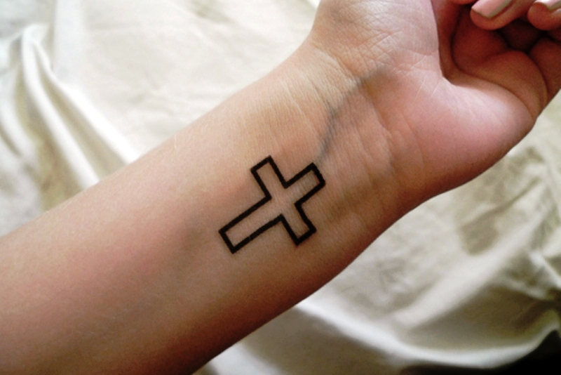 Simple Black Cross Tattoo On Wrist