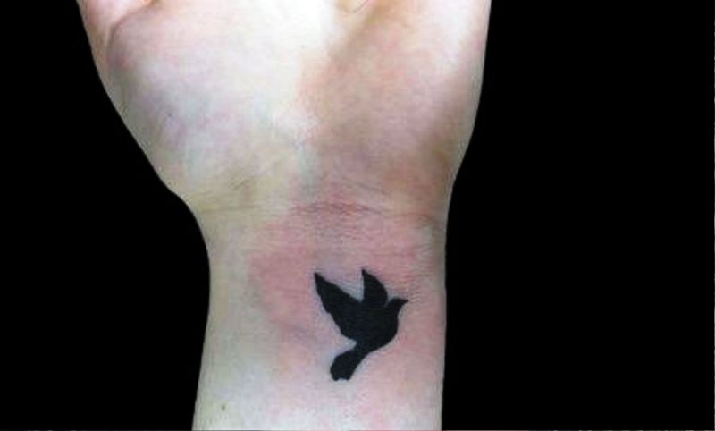 Simple Black Inked Flying Tattoo