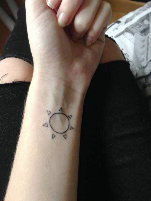 Simple Sun Tattoo On Wrist