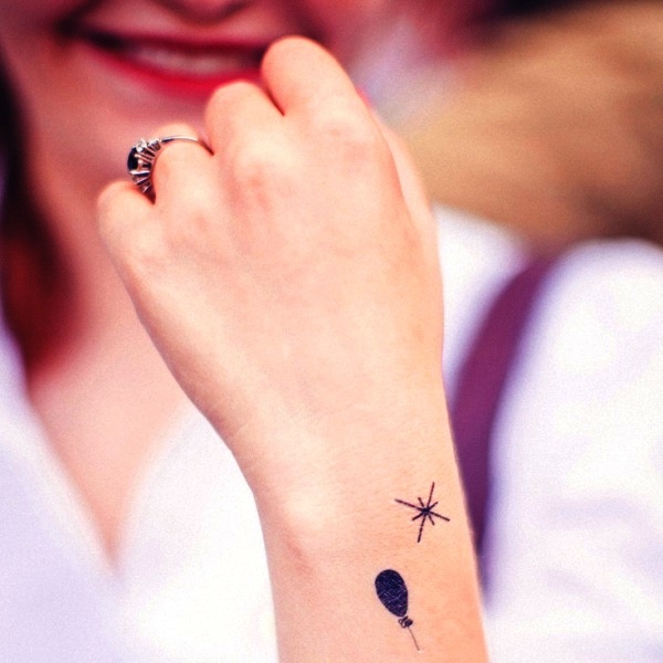Small Black Balloon Tattoo On Wrist