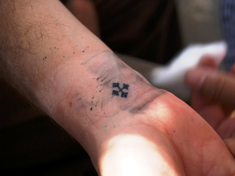 Small Black Cross Tattoo