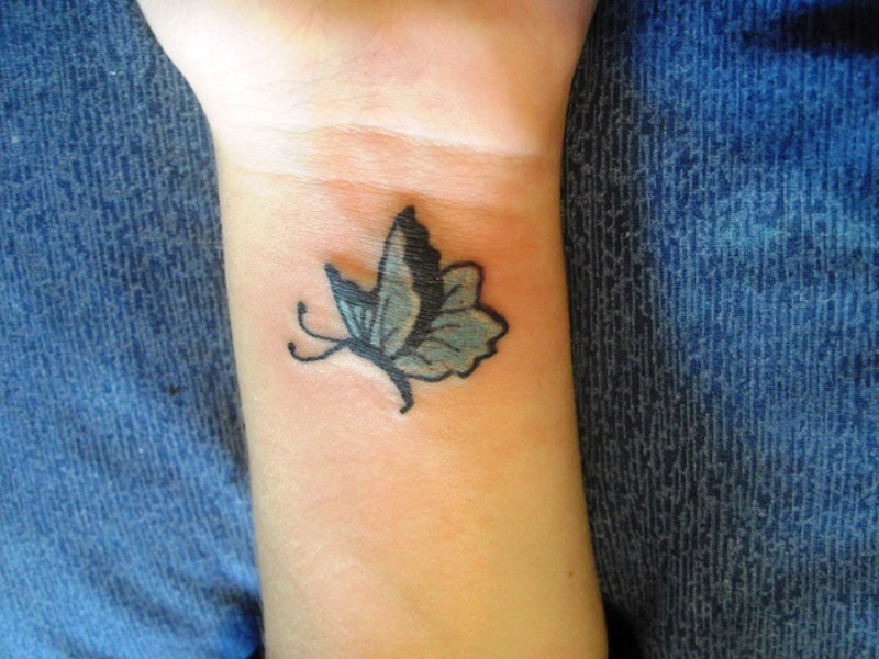 Small Colored Butterfly Tattoo On Wrist