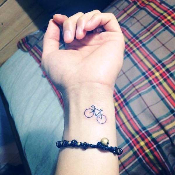 Small Cycle Tattoo On Wrist