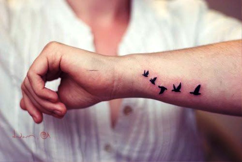 Small Flying Tattoo On Side Wrist