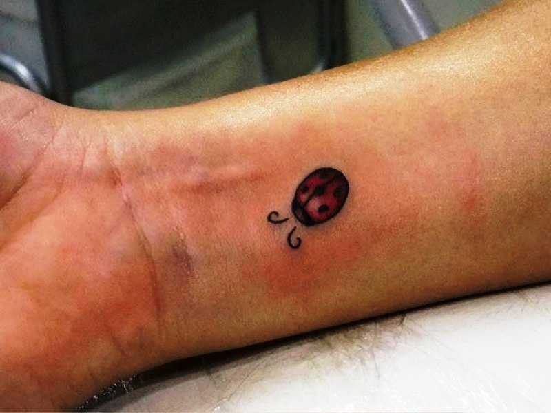 Small Ladybug Wrist Tattoo