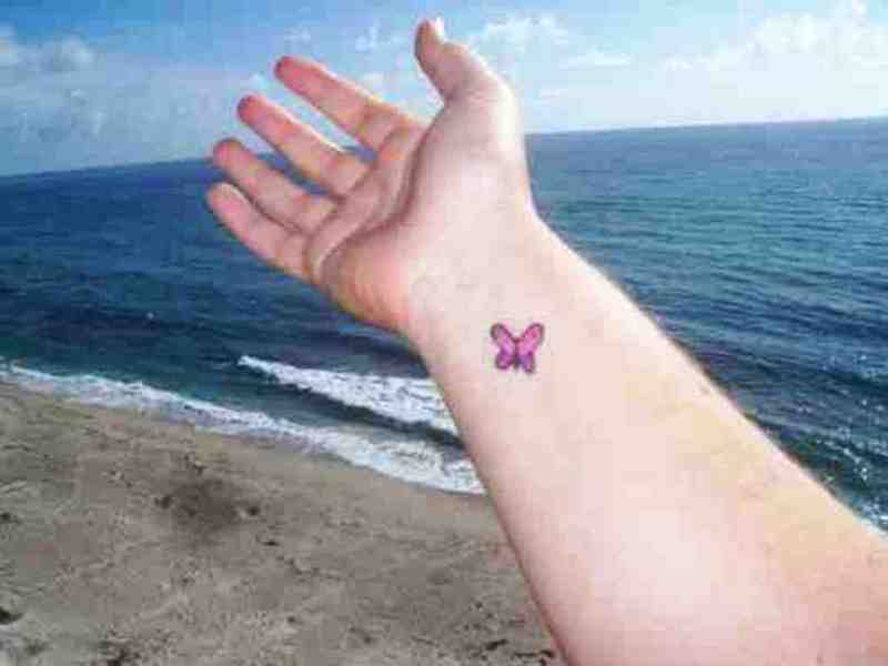 Small Pink Butterfly Tattoo On Wrist