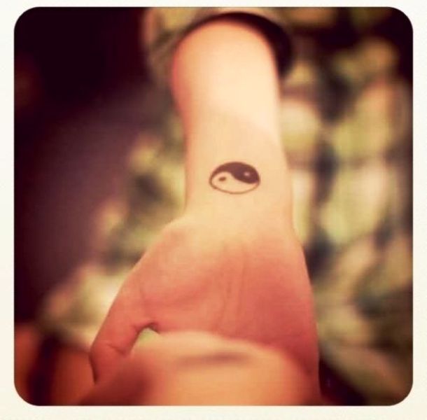 Small Yin Tattoo On Wrist