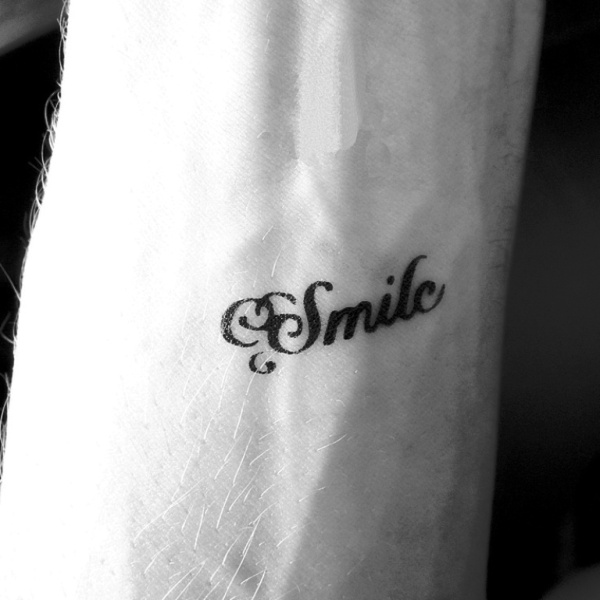 Smile Word Tattoo On Wrist