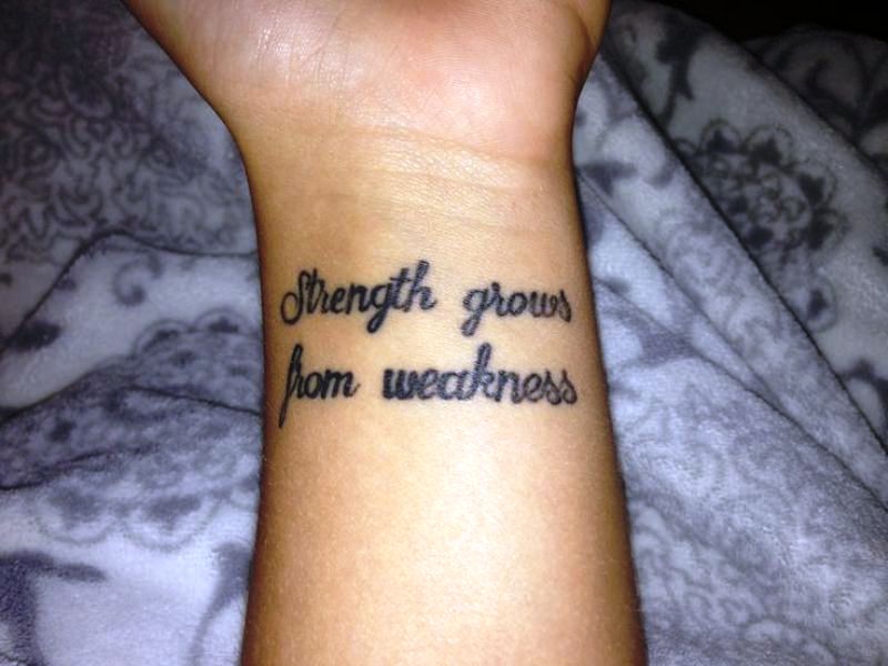 Strength Grows Quote Tattoo On Wrist