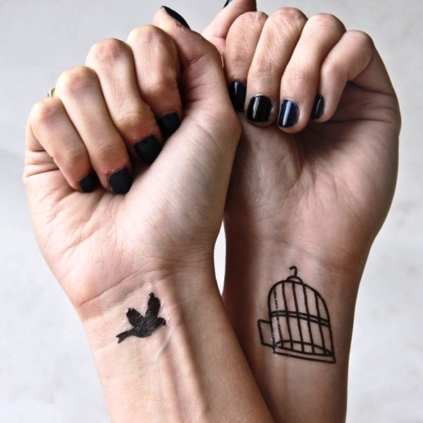 Stunning Bird And Cage Wrist Tattoo