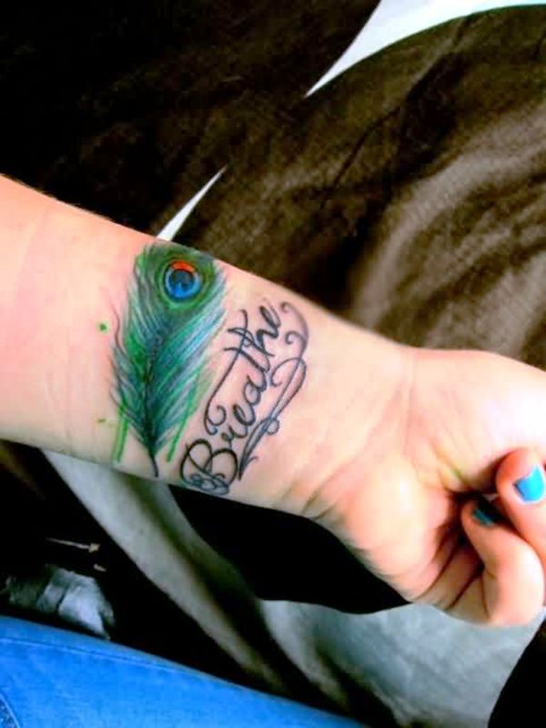 Stunning Peacock Feather Wrist Tattoo