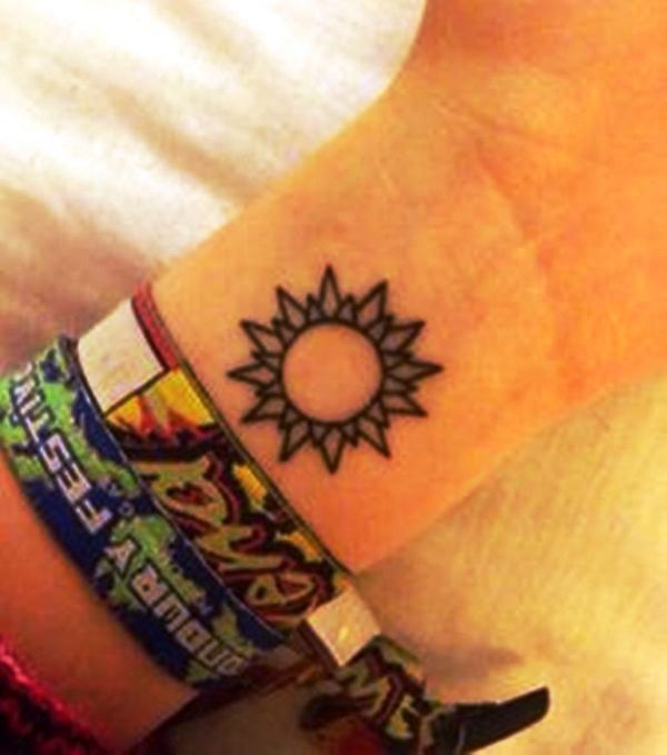 Stunning Sun Tattoo On Wrist