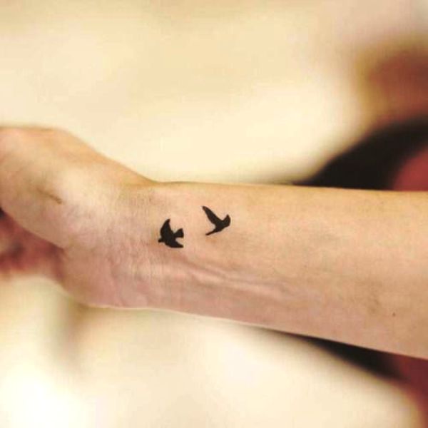 Superb Flying Birds Tattoo On Wrist