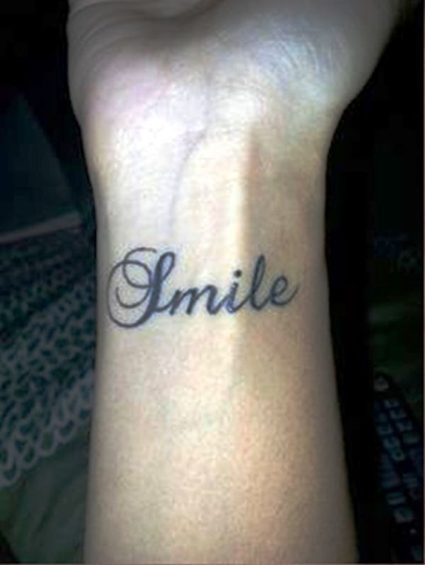 Sweet Smile Tattoo On Wrist