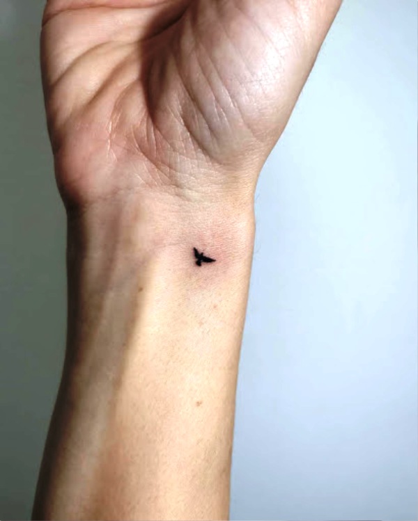 Tiny Bird Tattoo On Wrist