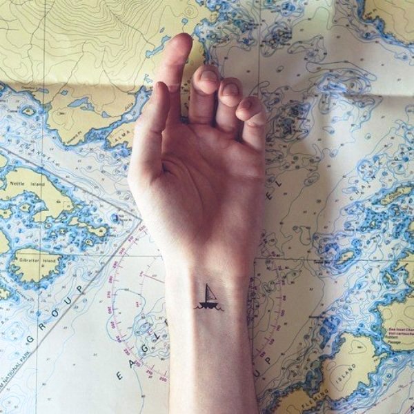 Tiny Boat Tattoo On Wrist