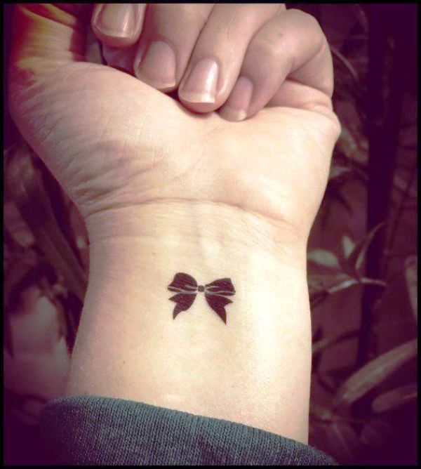 Tiny Bow Tattoo On Wrist