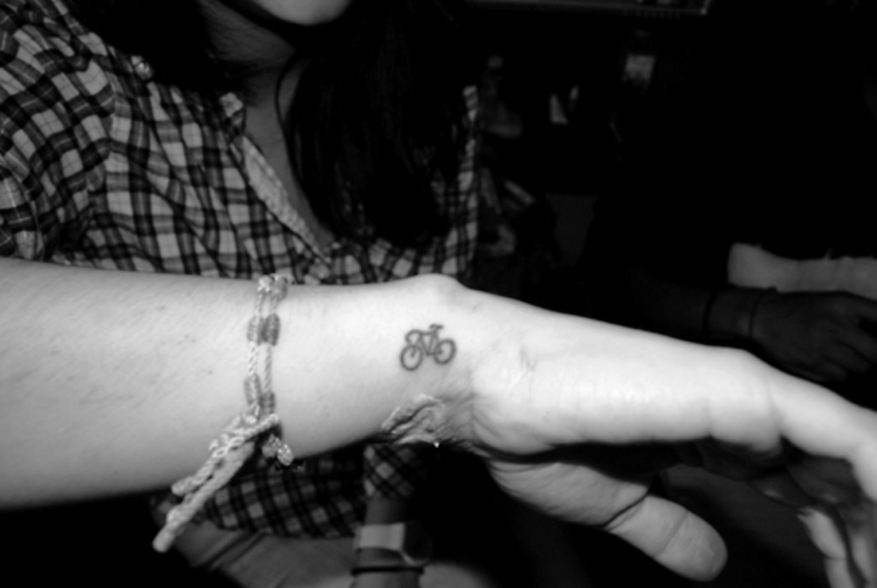 Tiny Cycle Tattoo On Wrist
